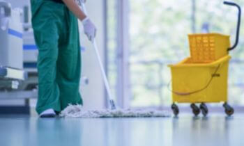 A man conducting medical office cleaning for a Maryland Heights, MO facility
